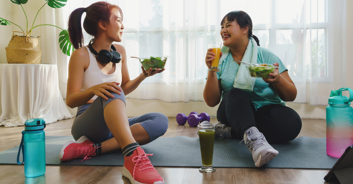 Two ladies eating after workout